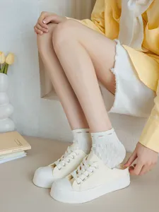 Women spring summer breathable mesh low-cut socks with cute bear and floral pattern details.