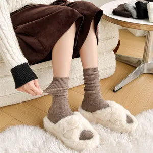 Close-up detail of women thick wool ribbed slouch socks, warm winter knit casual hosiery.