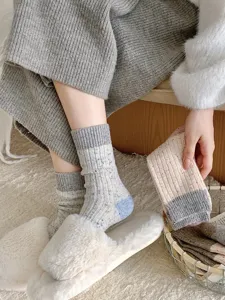 Thickened speckled yarn slouch wool socks with cable-knit texture, cozy winter home wear style.