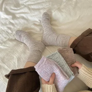 Cozy woolen slouchy socks for women, thick thermal knit long socks for autumn and winter home wear.