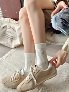 Detailed view of women summer thin mid tube socks with trendy star pattern and ribbed design.