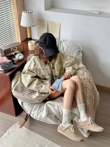Detailed lifestyle view of women's thin mid-tube star patterned socks in cozy room.