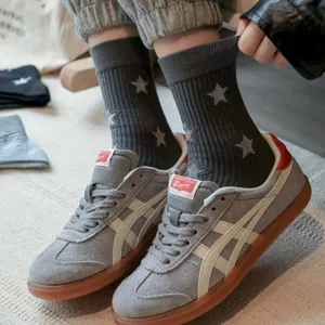 Dark grey ribbed crew socks with embroidered star pattern, stylish casual wear for women.