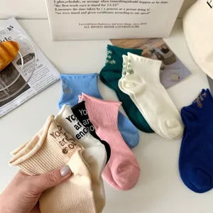Japanese style sweet ruffle edge low cut socks with cute letter embroidery for daily wear.