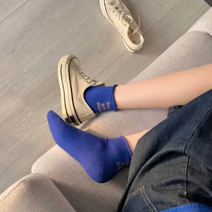 Blue cotton short socks with embroidered letters, comfortable and breathable everyday wear style.