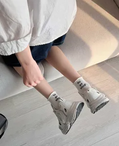 White women's short socks with letter print detailed casual style daily lifestyle shot