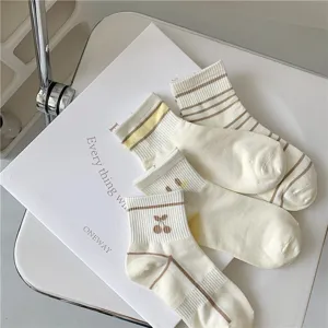 Detail view of Japanese style summer short socks featuring cute cherry and stripe patterns.