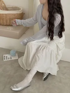 Korean style white lace ruffle socks paired with silver ballet flats and layered skirt outfit.