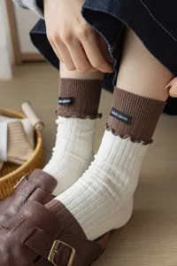Women's cute contrast color crew socks with lettuce edge and sweet ruffles design.