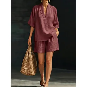 Casual women's two-piece short sleeve V-neck top and matching shorts for summer daily wear.