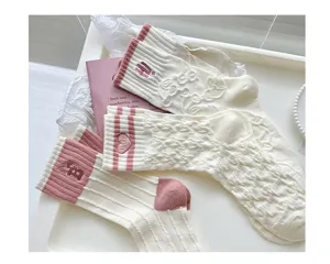 Cute embroidered women mid tube socks, sweet pink and white cotton blend hosiery for spring.