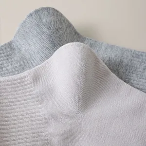 Close-up of ribbed cotton men's socks showing fine knit texture and soft fabric details.