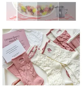 Cute embroidered women mid-tube socks with floral pattern, cozy knit cotton daily wear detail view.