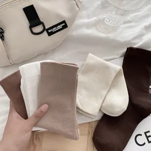 Comfortable mid-calf socks set in versatile neutral colors, perfect for daily casual wear.