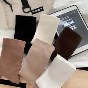 Detailed view of comfortable solid color mid-calf socks presented in multi-color neutral shades.