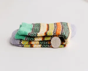 Retro ethnic style knitted wool socks detail view, cozy winter casual warm footwear item.