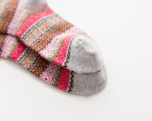 Cozy winter wool socks featuring vintage ethnic geometric patterns and soft knit fabric.