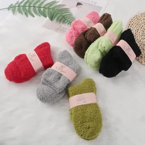Solid color coral fleece sleep socks fluffy cozy mid-tube winter warm socks flat lay