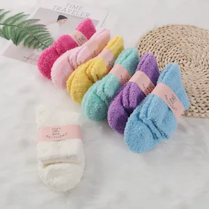 Cozy coral fleece sleep socks in multiple vibrant colors, soft and warm for winter indoor wear.
