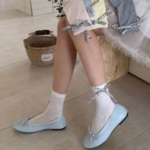 Women's floral bow mesh mid tube socks paired with flat Mary Jane shoes for spring and summer.