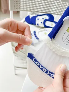 Detailed view of women's summer breathable sheer mesh invisible socks with cute letter details.