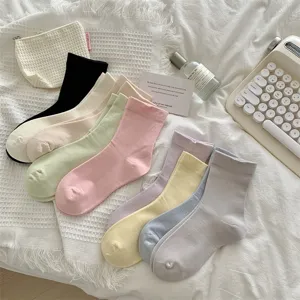 Cute mid-tube women socks in multiple pastel colors, soft cotton knit, perfect for daily wear.