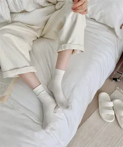 Cozy cream white women mid-tube socks, soft comfortable cotton daily casual hosiery style.