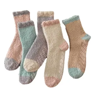 Cozy fuzzy coral fleece floor socks with anti-slip grips, perfect for winter warmth.