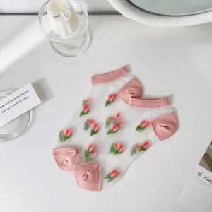 Sheer mesh ankle socks for women, featuring delicate floral embroidery and pink heels and toes.