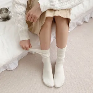 Cute Japanese style white cotton mid-tube socks women detail view, comfy spring daily wear.
