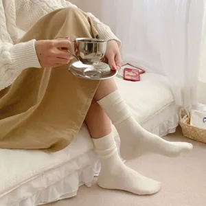 Cute Japanese JK white frilly mid-tube stack socks for women, thin vertical striped design.