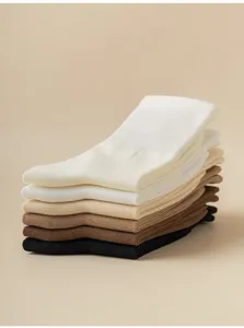 Comfortable ribbed crew socks in neutral colors, soft cotton knit blend for daily wear.