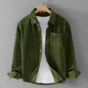 Men's green corduroy long sleeve shirt casual button down shirt with white tee layer.