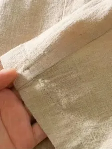 Detalle de tela de chaqueta casual de lino para hombre blazer liso y transpirable