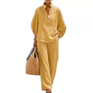 Detail view of women's casual linen two-piece set featuring button-up shirt and wide-leg pants.