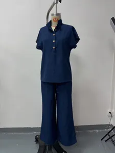 Detail view of the solid blue women's casual short-sleeve top and wide-leg pants set.