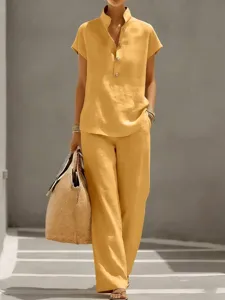 Details of the solid color casual short-sleeve top and pants set in lifestyle scene.
