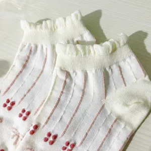 Cute sweet ruffles summer women short socks with pink vertical stripes and floral details.