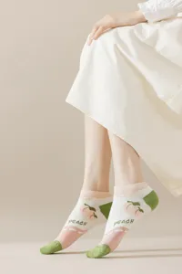 Close-up detail of cute peach print low-cut socks, Japanese style soft cotton ankle socks.