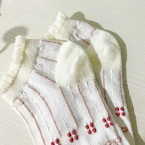 Japanese style women short socks with sweet lace ruffles and cute floral pattern details.