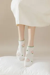 Detail view of cute peach printed women short socks, soft cotton fabric, sweet Japanese style boat socks.