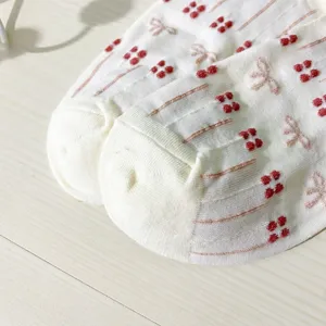 Cute Japanese style women short boat socks with sweet bow and floral patterns, breathable detail.