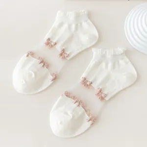 Delicate sheer lace short socks for women featuring cute bows, perfect for sweet JK style outfits.