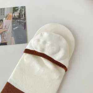 Women's shallow invisible socks with contrast brown trim and cute jacquard design for spring.