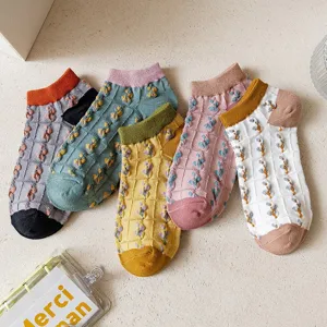 Detailed view of cute Japanese style women short socks with sweet floral patterns for summer.