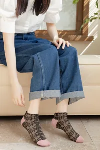 Close-up detail of women's vintage sheer short socks with cute pink toes and heels design.