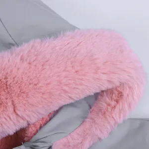 Close-up detail of winter women coat grey fabric with soft pink faux fur hood collar lining