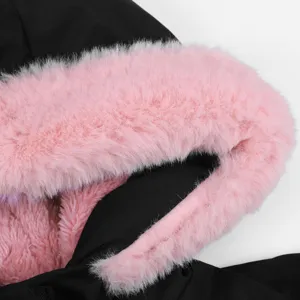 Detailed shot of a women's black hooded winter coat featuring fluffy pink faux fur trim.