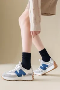 Retro casual fashion sneakers with black socks, comfortable trendy footwear for daily wear.