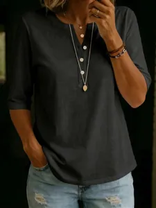 Details of the women's solid V-neck henley top showing fabric texture, buttons and fit.